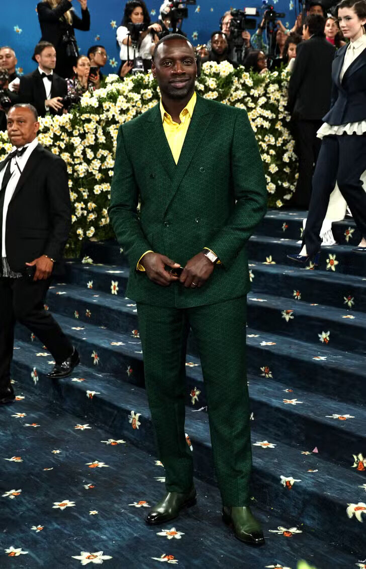 Omar Sy attends the Met Gala wearing Ozwald Boateng.