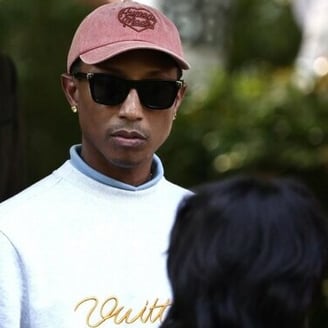 Pharrell unveils coffee brown denim as Paris fashion week begins