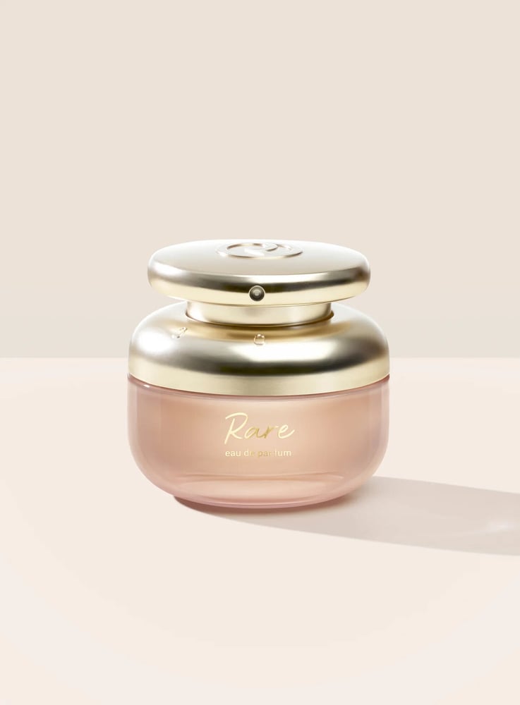 Rare Eau de Parfum in a rounded, gold-capped bottle designed for ergonomic ease