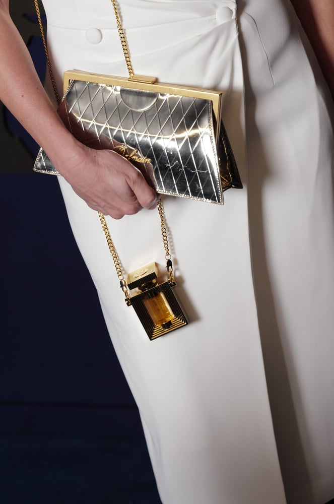 A custom perfume bottle accessory at the Johnnie Walker Vault x Olivier Rousteing Couture Expression event.